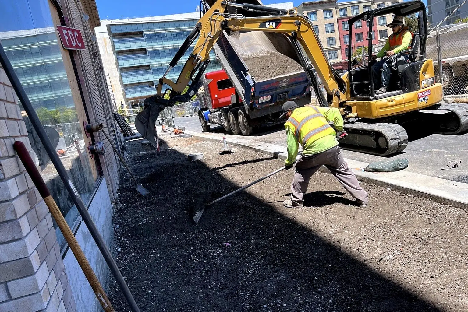 Excavation and aggregate base rock preparation ahead of new asphalt paving.