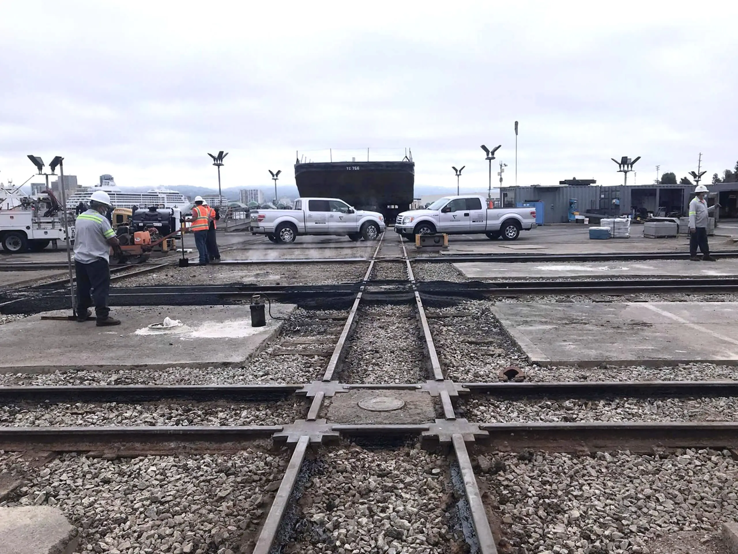 Crews working alongside the rail tracks that run through the Bay Ship Co. yard.