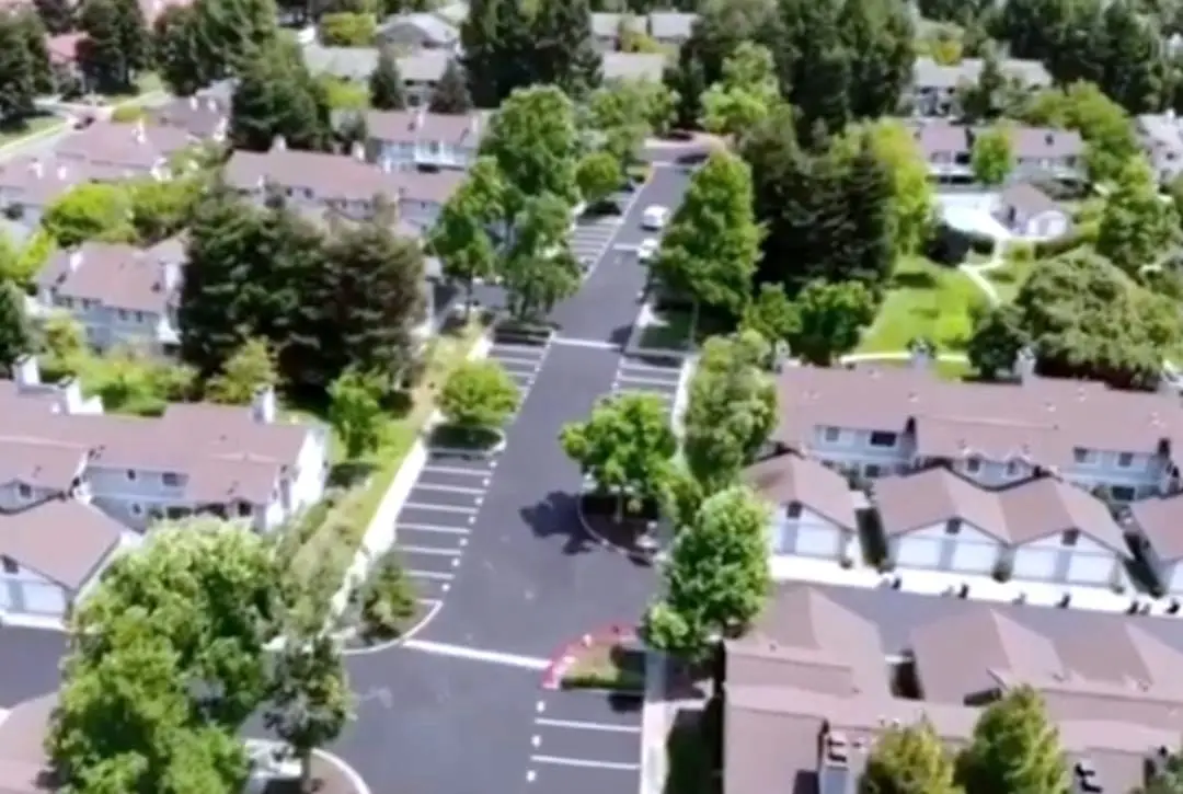Aerial view of The Crossings HOA in Fremont, showing the resurfaced parking areas and roadways through the community.