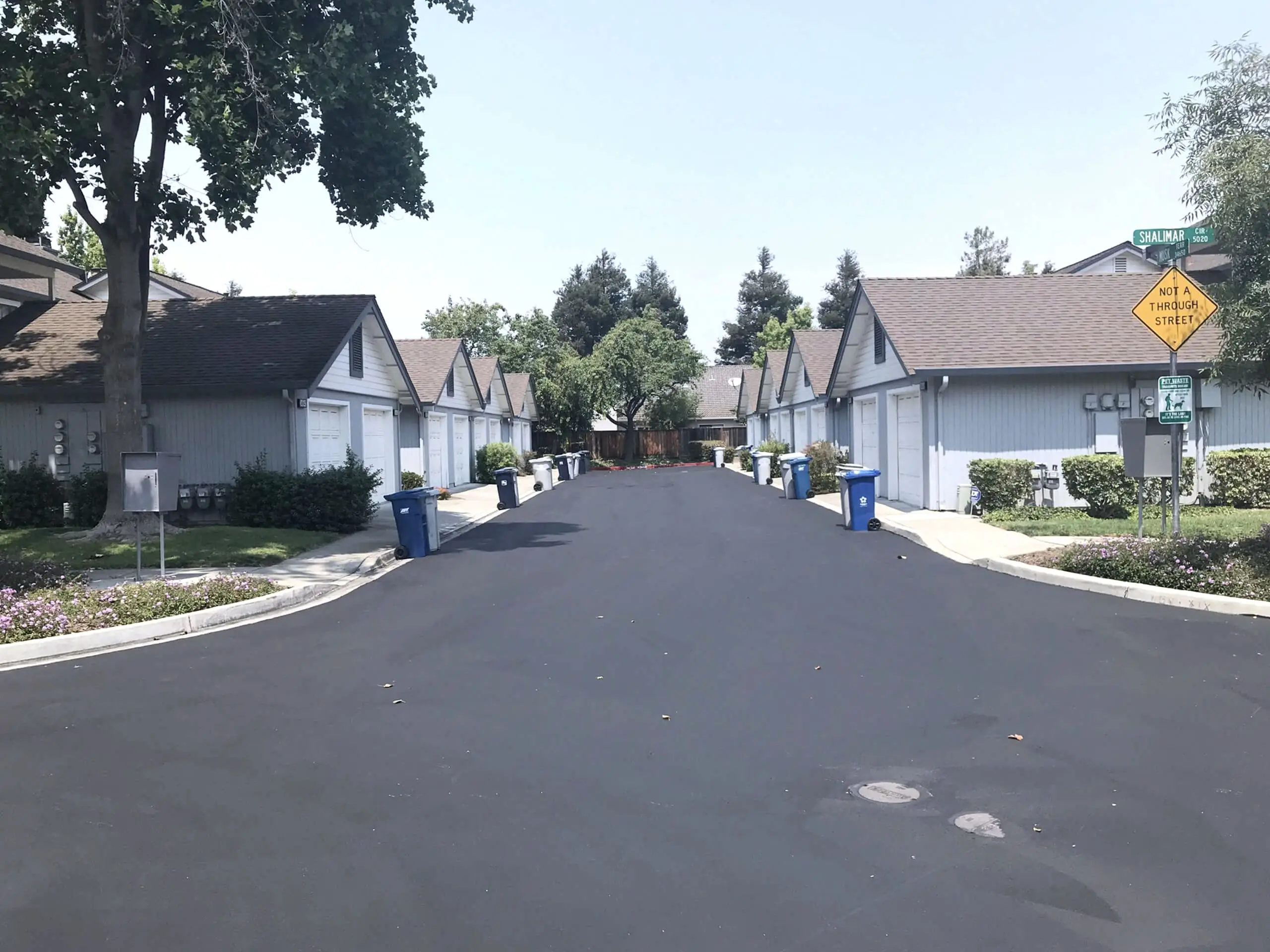 A sealed and restriped roadway running between homes at The Crossings HOA in Fremont.