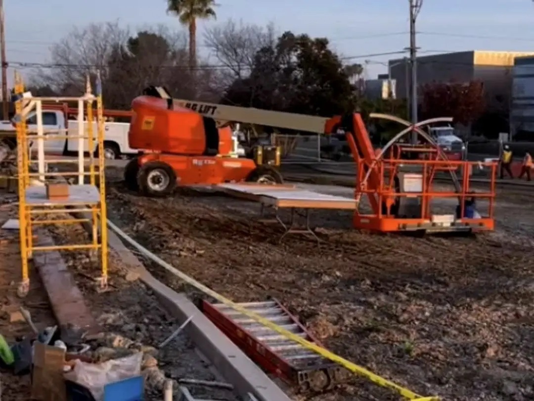 Excavated ground and formwork at the Concord dealership site during the subgrade correction.