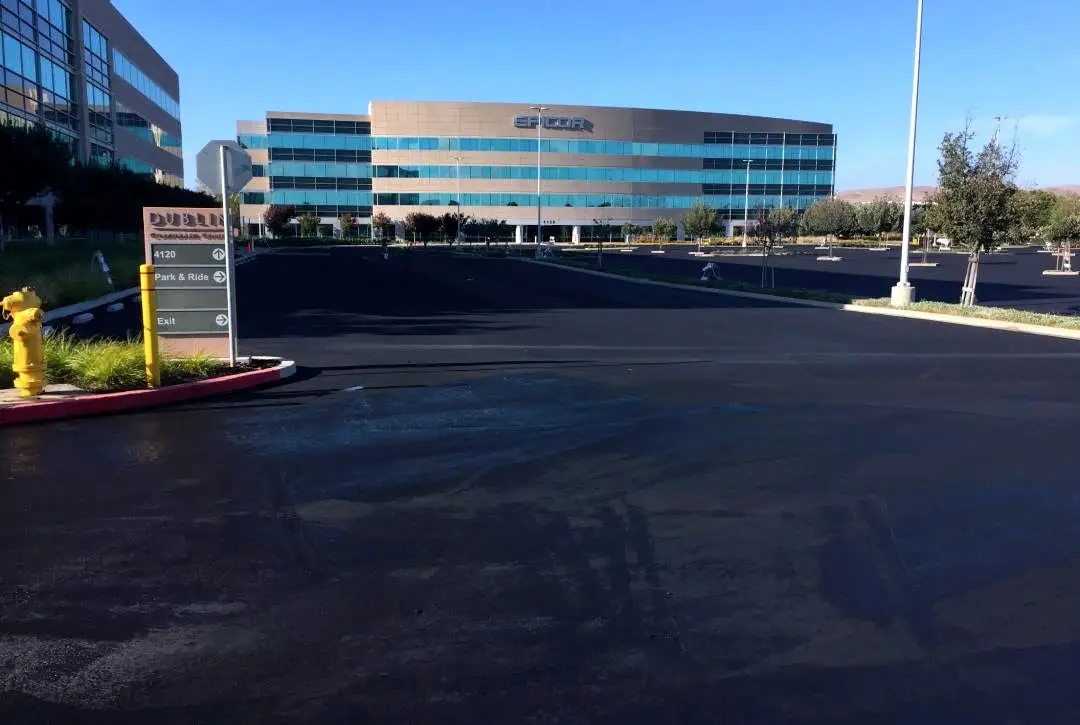 Heavy-duty asphalt pavement at a Bay Area industrial facility.