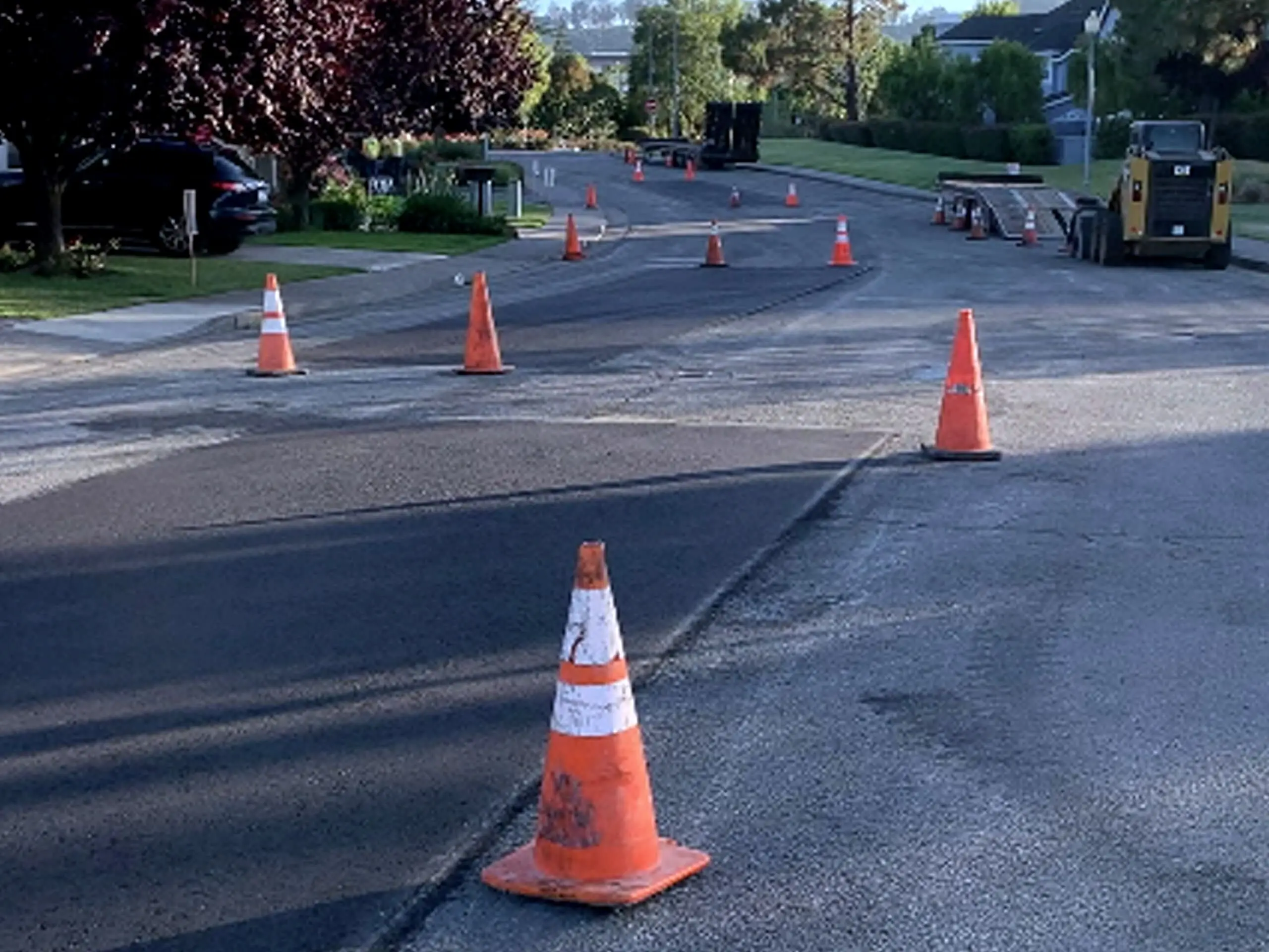 Traffic cones marking off the newly surfaced roadway through the Marin Lagoon community.